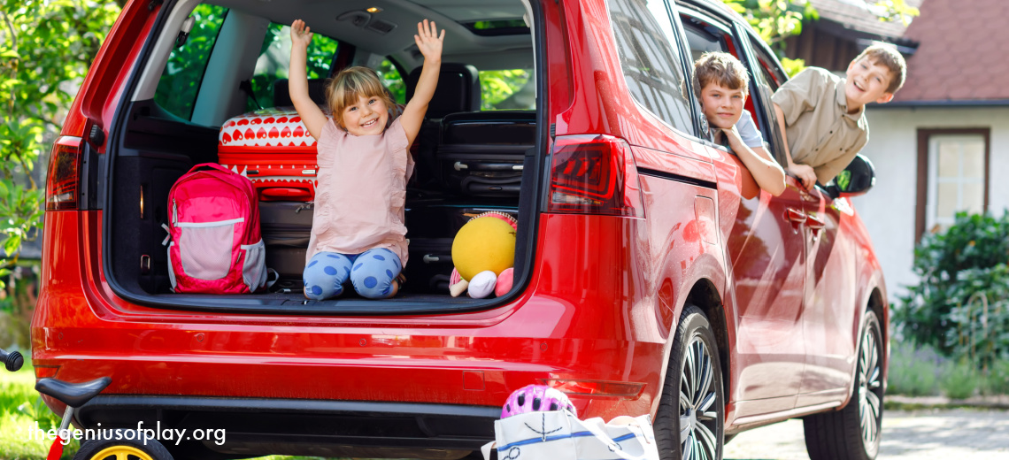 Happy siblings, brothers and sister with suitcases and toys sitting in their family car getting ready for a road trip